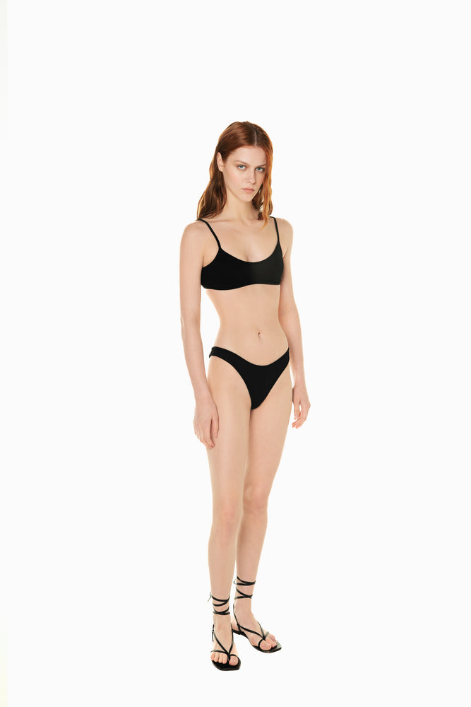 
                  
                    front of model wearing black bikini set Anine from Noodle Beachwear 2024 collection
                  
                