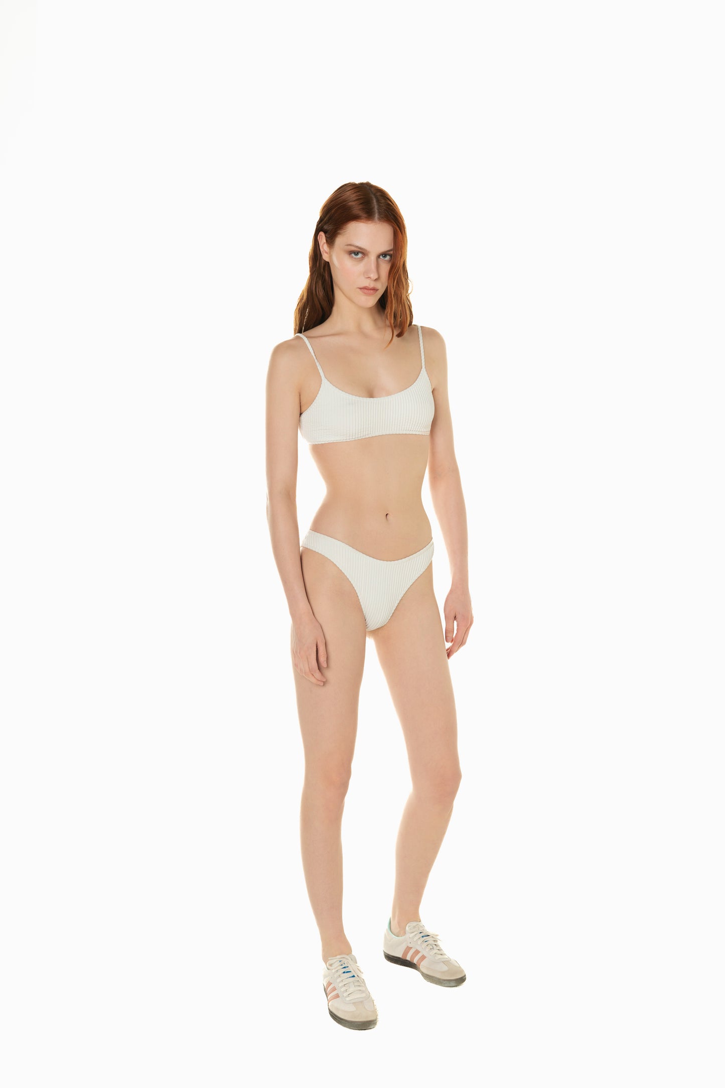 
                  
                    front of a model wearing white bikini set Anine from Noodle Beachwear 2024 collection
                  
                