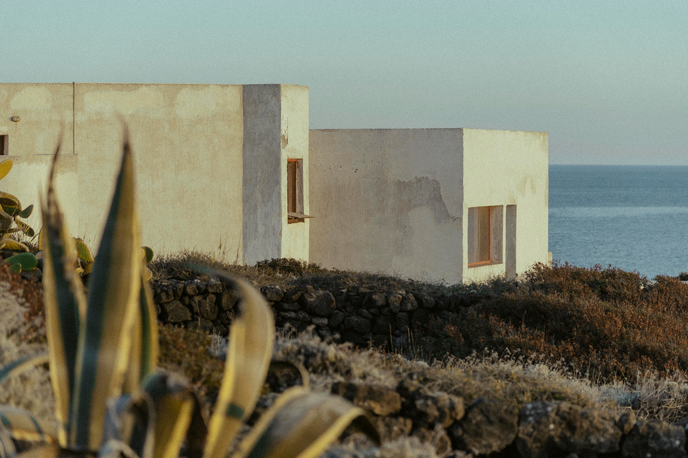 pantelleria landscape with sea, a white house and the wild nature, with the sunset lights