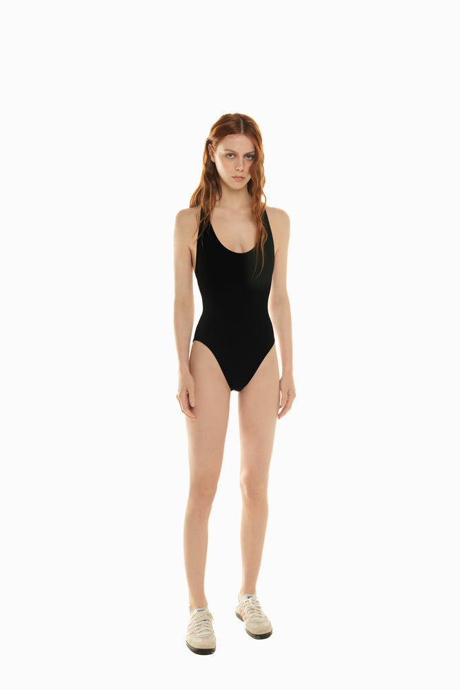 
                  
                    front of model wearing black swimsuit Rubina by 2024 Noodle Beachwear collection
                  
                